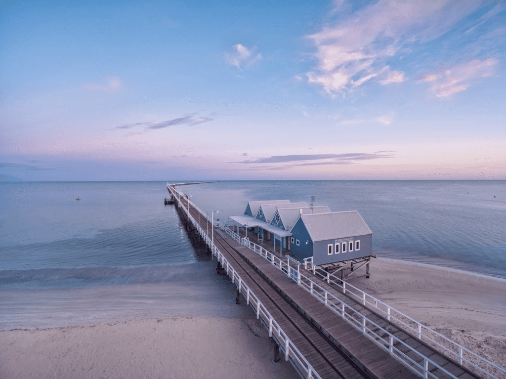 An aerial shot of the Interpretive Centre and the Busselton Jetty extending out to sea