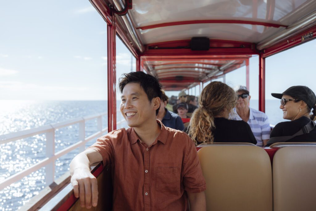 A man enjoying the view on the train ride along the Jetty